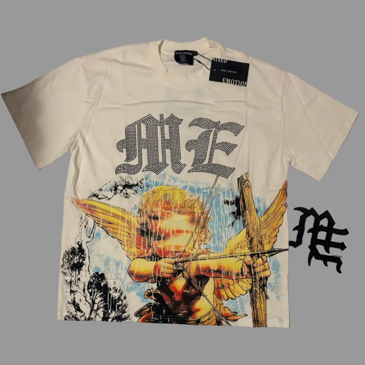 A white short-sleeve graphic t-shirt laid flat on a white fabric background. The shirt features a large gothic-style 'MFE' logo across the chest, with a colorful graphic of a winged cherub aiming a bow and arrow below.
